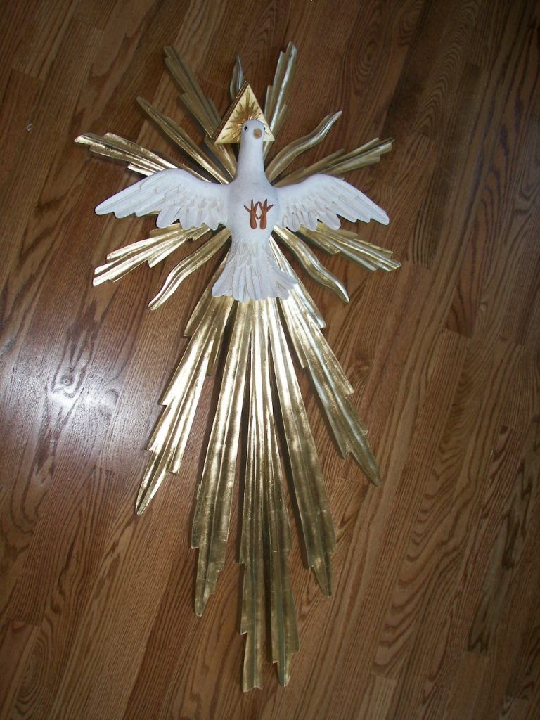 white dove with golden rays radiating from it