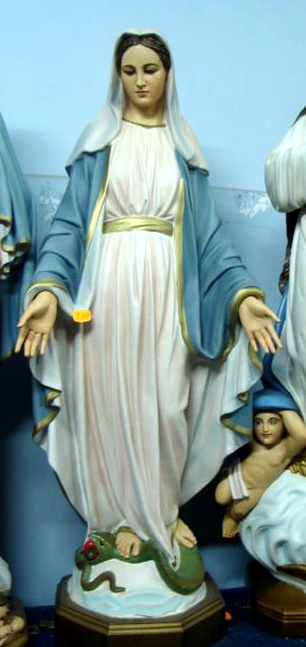 statue of a woman in blue and white robes with a serpent