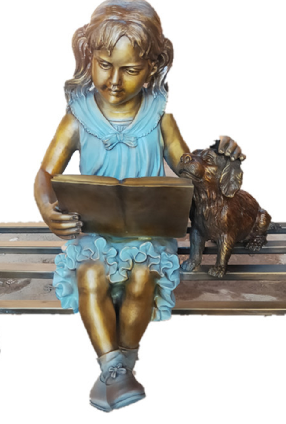 Bronze sculpture of a girl reading with a dog beside her