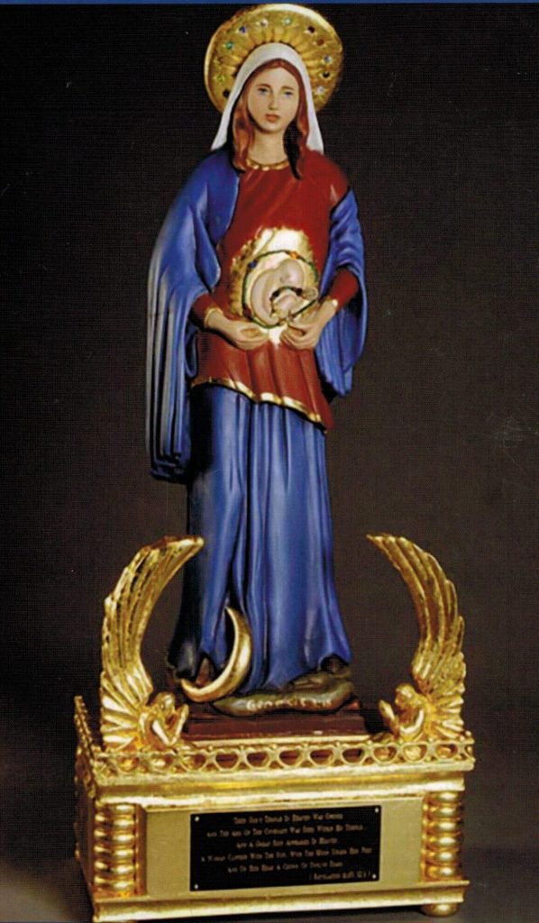 colorful statue of a religious figure holding a circular object