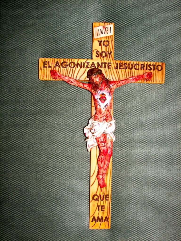 colorful wooden crucifix depicting Jesus Christ on the cross
