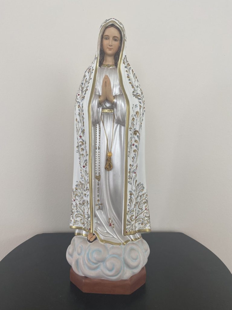 figurative sculpture of a woman in religious attire
