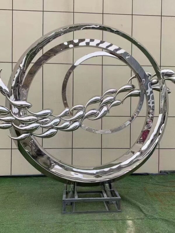abstract sculpture of a fish in a circular frame