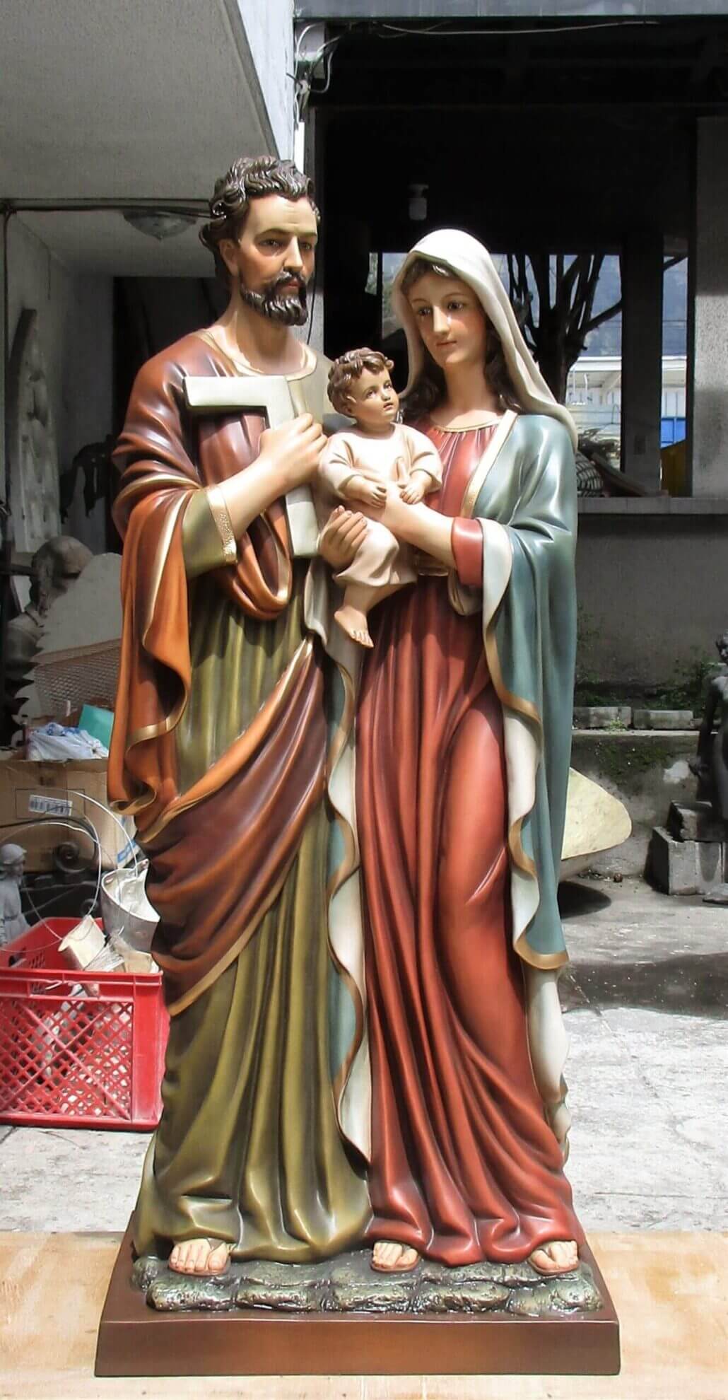 colorful statue of a holy family with Joseph, Mary, and baby Jesus
