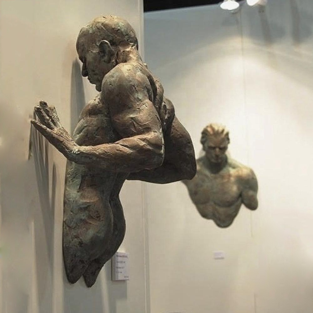 Contemplative Man on Wall Sculpture