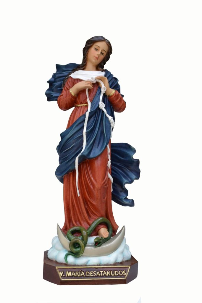 figurative sculpture of a woman in flowing robes with a serpent