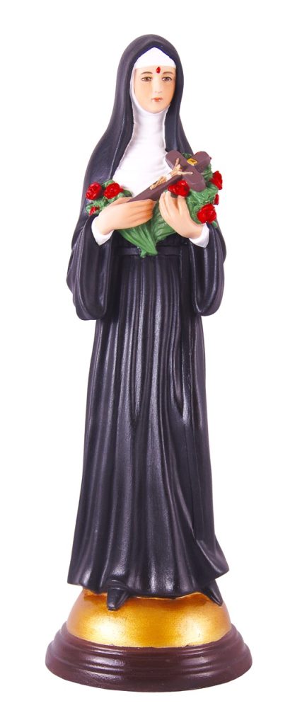 figurine of a nun holding flowers and a cross