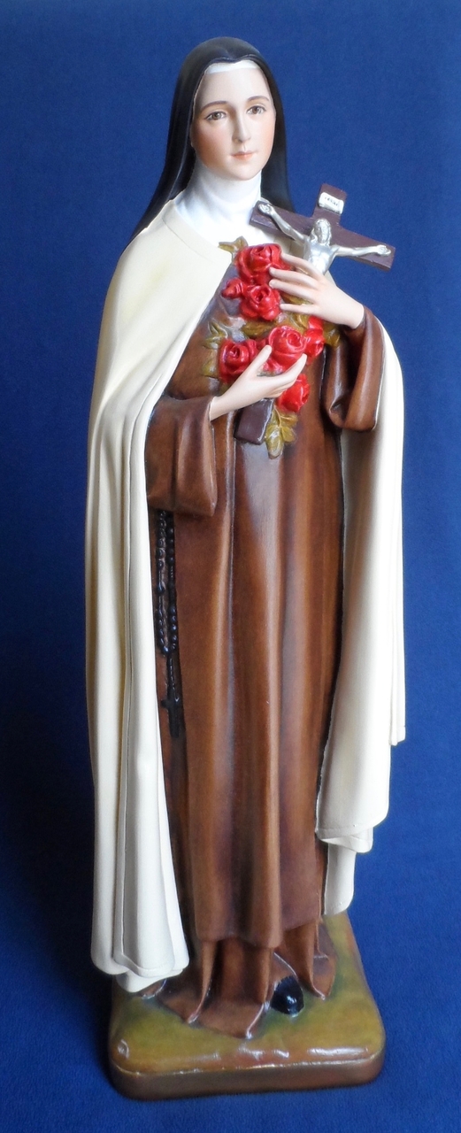 figurine of a saint holding roses and a cross