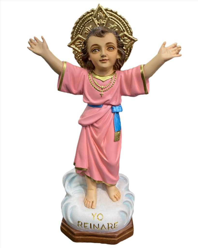 figurine of a child saint with outstretched arms