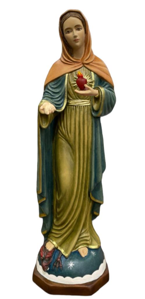 figurative sculpture of a woman in flowing robes with a heart