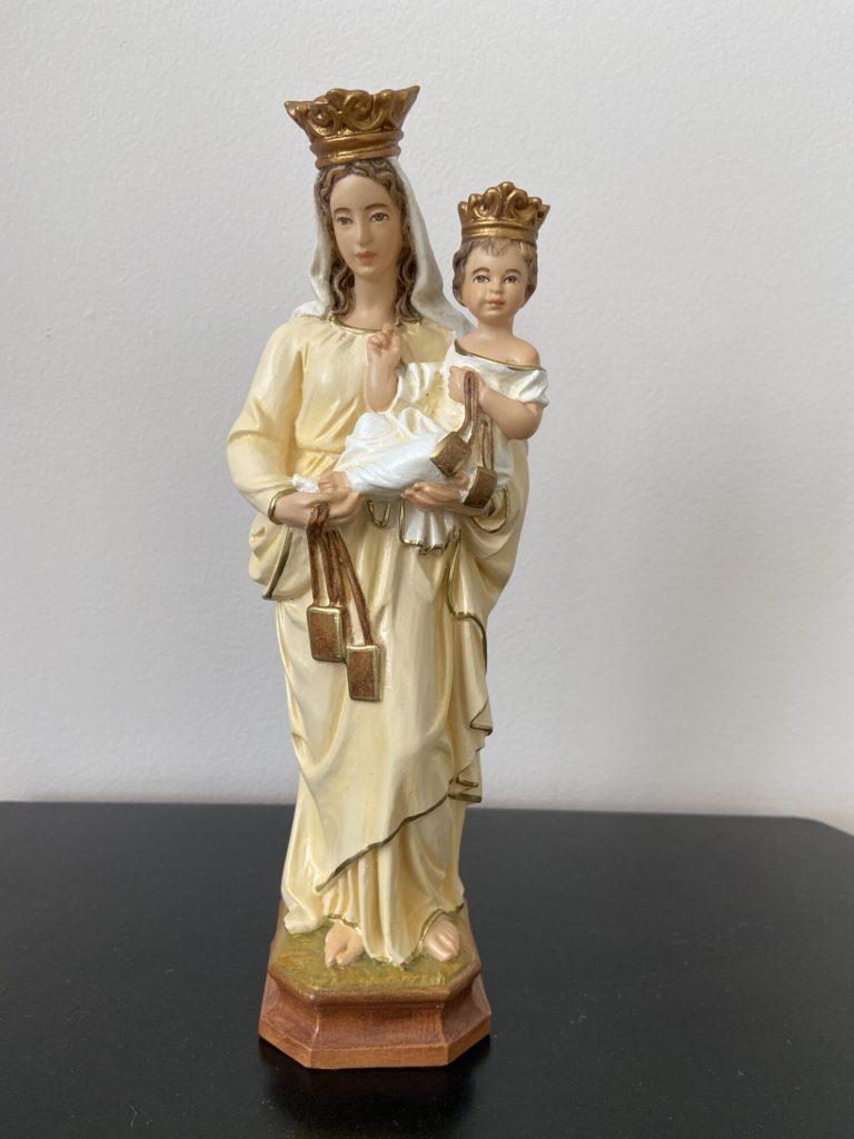figurative sculpture of a woman holding a child
