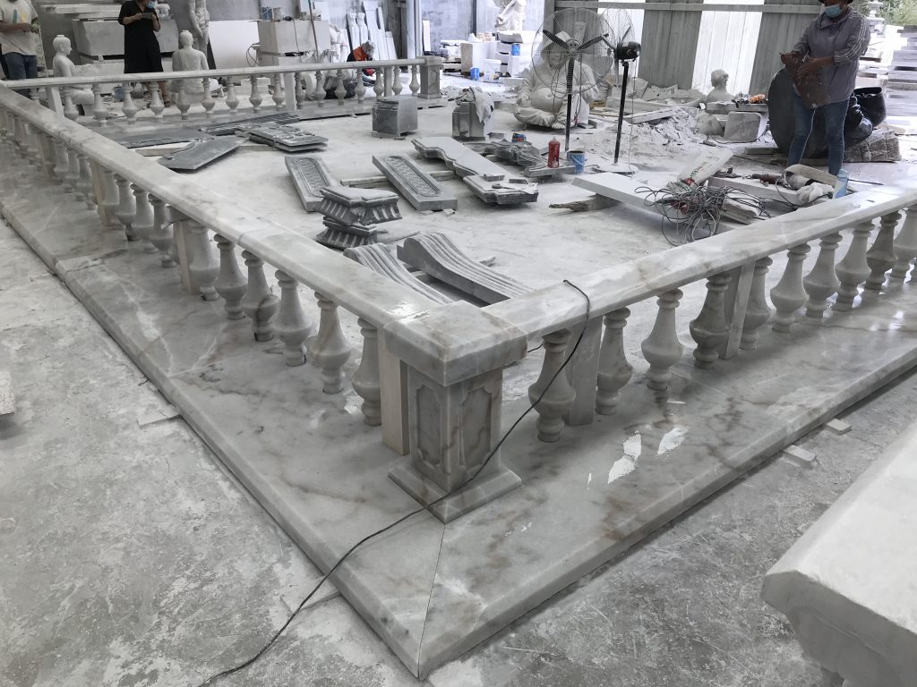 marble sculpture workshop with unfinished balustrade and tools