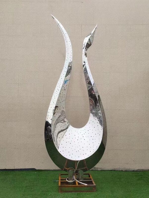 abstract swan sculpture with polished surface and elegant curves